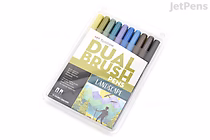 Set of 10 Tombow Dual Brush Pens in a clear plastic case, arranged horizontally with brush tips visible. The packaging features the product name and an illustration of a landscape.
