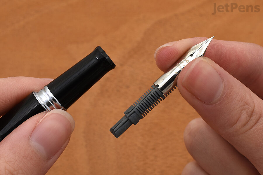 3. Repeat steps 1 and 2 with the second pen. To install the nib and feed, make sure they are properly aligned (the nib will fit against a notch on the feed). Push the nib and feed into the empty grip section.