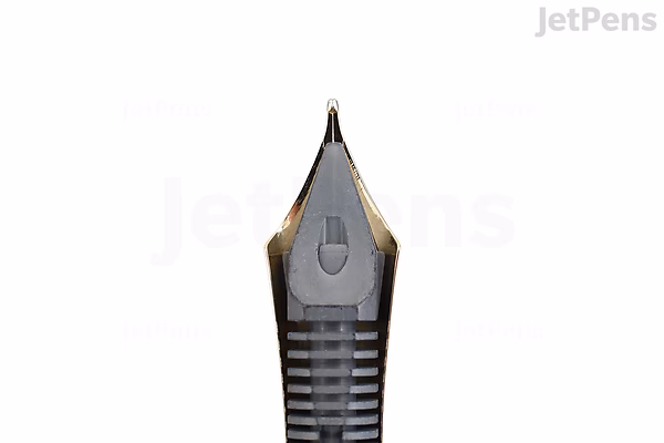 Close-up view of the nib of a Pilot Custom 743 fountain pen, featuring a black body and a 14k medium gold nib.