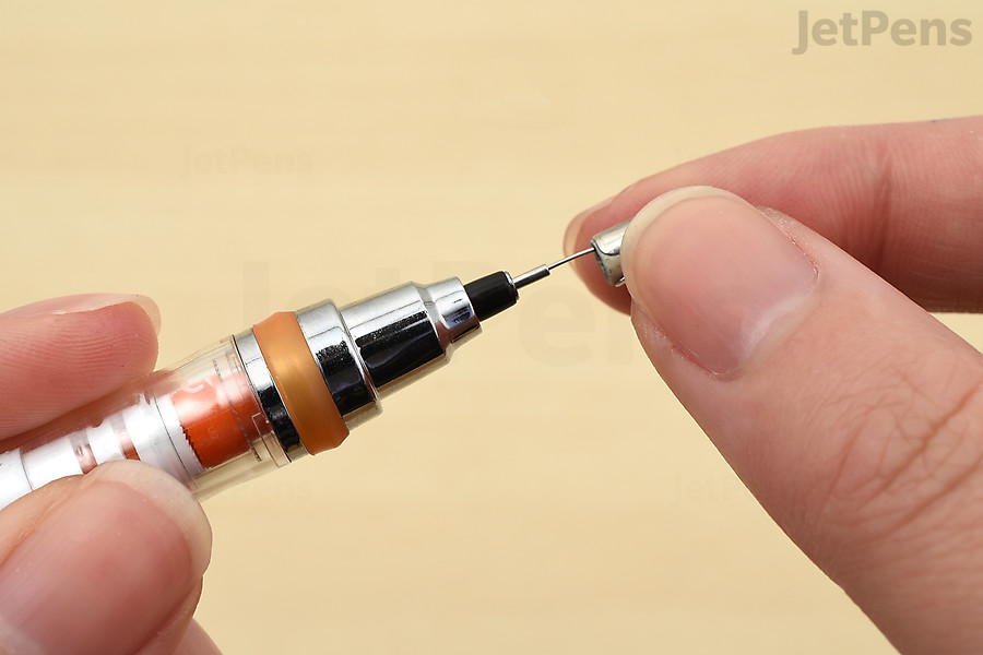 Insert the clean-out rod into the tip.