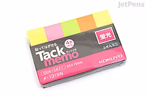 A pack of KOKUYO Tack Memo N sticky notes in mini size (5.0 cm x 1.5 cm) featuring four bright colors: yellow, pink, green, and orange. The packaging is primarily white with pink and black accents and includes Japanese text.