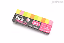 A small rectangular pack of KOKUYO Tack Memo N sticky notes in super mini slim size (2.5 cm x 0.7 cm) featuring four bright colors: yellow, green, orange, and pink. The packaging is black with colorful stripes matching the sticky notes.
