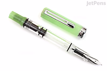 A TWSBI ECO Glow Green limited edition fountain pen with a fine nib, shown disassembled into two parts: the translucent green cap with a silver clip, and the clear barrel with green accents and a silver nib.