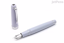 A sleek, light blue fountain pen with a silver nib and a matching cap placed beside it. The pen is labeled as the Sailor Pro Gear Winter Sky Limited Edition with a 21k extra fine nib.