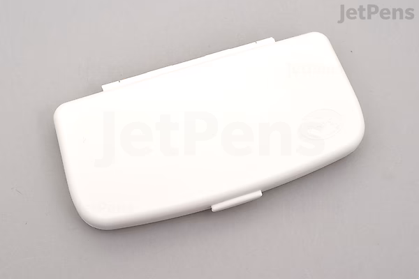 Closed white rectangular plastic case with rounded edges, shown against a gray background.
