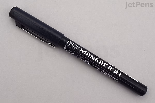 Black dual-tip marker pen with the label "MANGAKA 01" on its body, placed on a light gray surface.