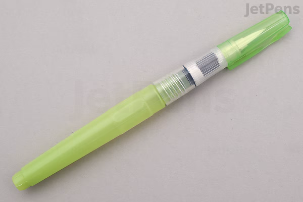 A compact, lime green watercolor brush pen with a transparent section near the middle, showing the brush tip inside. The pen is designed for use with watercolor paints.