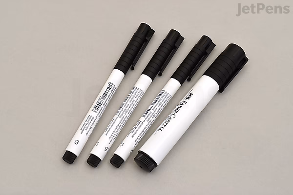 Four Faber-Castell PITT Artist Pens in white, arranged in a row by size, labeled B, C, 1.5, and 2.5, with black caps and white barrels.