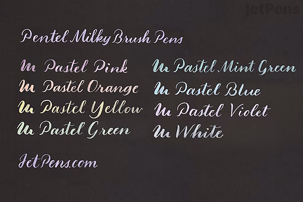 Handwritten text samples on black paper created with Pentel Milky Brush Pens in various pastel colors, including Pastel Pink, Orange, Yellow, Green, Mint Green, Blue, Violet, and White. Each color is labeled in matching ink.