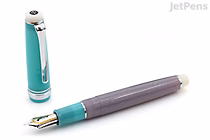 Sailor Pro Gear Slim fountain pen with cap removed, showing 14k fine nib. Limited edition "Follow the Mermaid" design with a sleek, elegant body and contrasting cap.