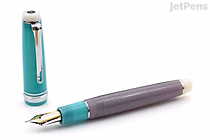 A Sailor Pro Gear fountain pen with the cap removed and placed upright beside it. The pen has a teal cap with a silver clip and a purple barrel. The nib is silver with gold accents.