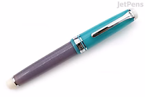 A Sailor Pro Gear fountain pen with a turquoise cap and a dark purple barrel. The pen features silver accents, including a clip and a band near the cap. This is the limited edition "Follow the Mermaid" model with a 21k broad nib.