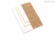 Three sheets of planner paper labeled "Yamamoto Paper Tasting - Planner Paper Vol. 2," featuring different paper types in white, cream, and brown with printed text and grid patterns on the brown sheet.
