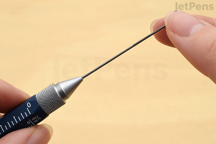Insert the new lead into the tip of the pencil.