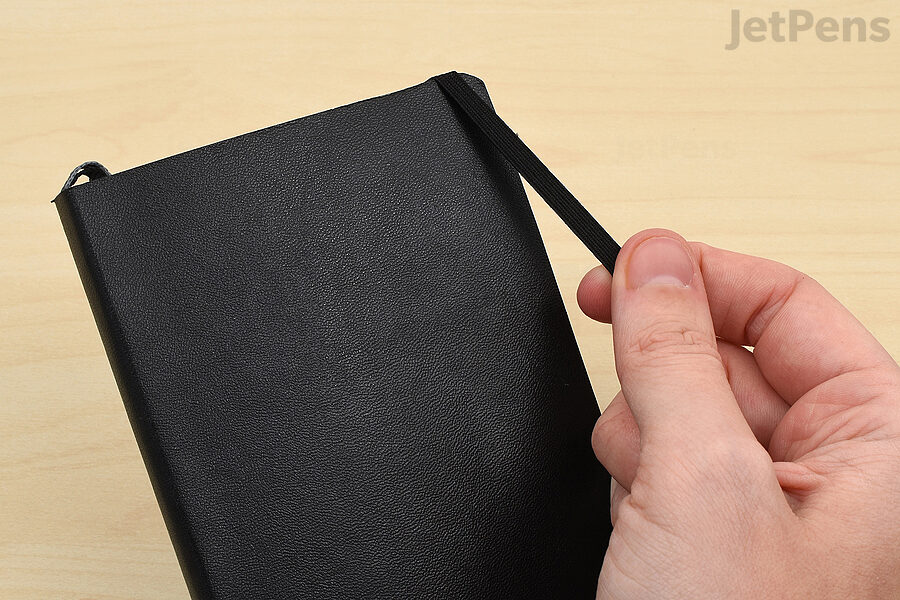 An elastic closure prevents the book from opening while in your bag.