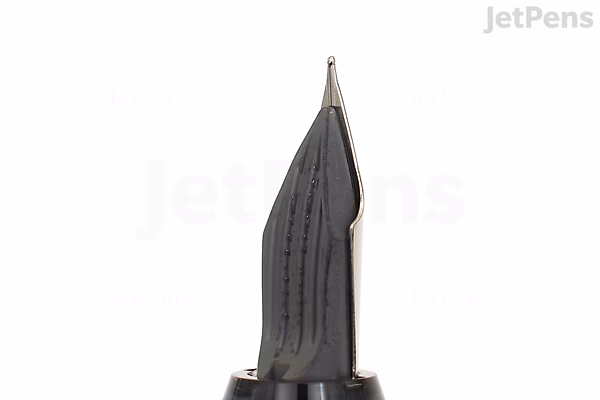 Close-up image of a gray Pilot Explorer fountain pen nib with a fine tip, featuring a textured grip area and a sleek metallic point.