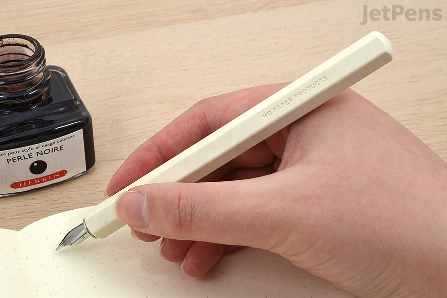 The MD Dip Pen is inked by dipping the nib into a bottle of ink.