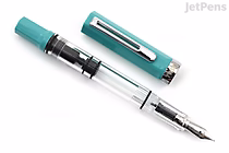 A TWSBI ECO Persian Green Limited Edition fountain pen with a fine nib, shown uncapped and lying on a white surface. The pen features a transparent barrel and a green cap and grip section.