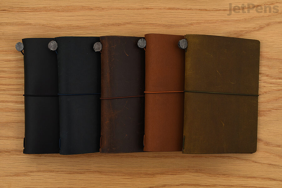 Passport TRAVELER’S notebooks, from left to right: Black, Blue, Brown, Camel, and Olive.