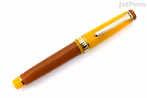 Sailor Pro Gear Fountain Pen in a limited edition design with a brown and yellow body, featuring a gold clip and trim.