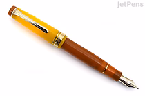 A Sailor Pro Gear fountain pen with a yellow-orange cap and a brown barrel, featuring a silver clip and a 21k gold nib. The pen is displayed diagonally on a white background.