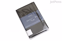 A KOKUYO PERPANEP Premium Notebook with a black cover, labeled "Sara Sara" and featuring 4 mm graph paper, shown in its original plastic packaging.
