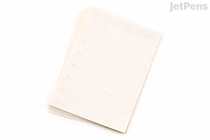 A stack of beige, rectangular weekly planner stickers with undated, lined sections for writing, designed for removable use. The stickers have a simple, minimalist layout with faint lines and small text headers.