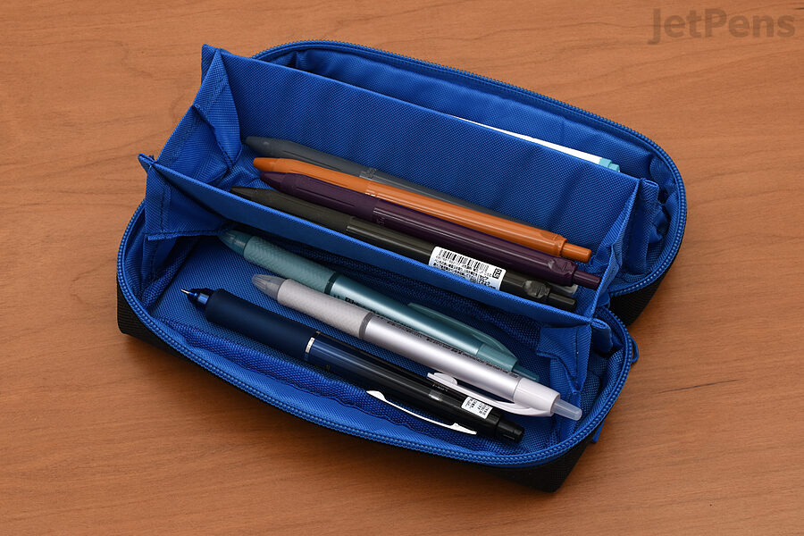 The Kamio Japan Paco-Tray Pen Case opens up to reveal three tray-like compartments.