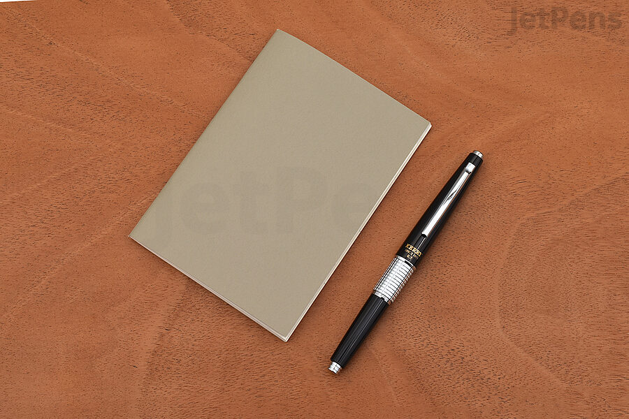 The TRAVELER'S COMPANY TRAVELER'S Passport Size notebook is just slightly smaller than a standard pocket notebook.