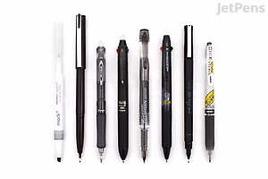 A lineup of seven pens arranged horizontally on a white background, labeled as JetPens Hobonichi Techo Recommended Pens Sampler. The pens vary in design and color, mostly black with some white and silver accents.