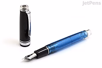 Sailor Pro Gear Fountain Pen in Iris Nebula limited edition, featuring a translucent blue barrel, black grip section, silver clip, and a 21k fine nib, shown uncapped with the cap placed beside it on a white background.