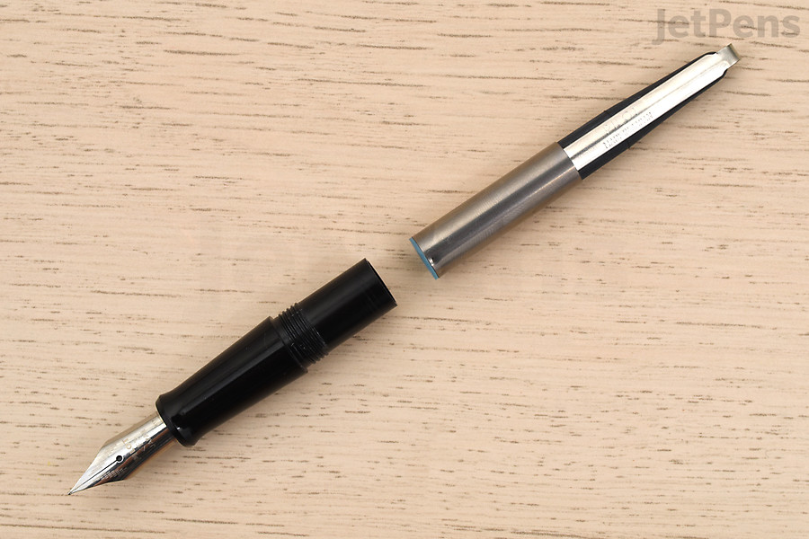This type of fountain pen fills from an ink bottle with a converter.
