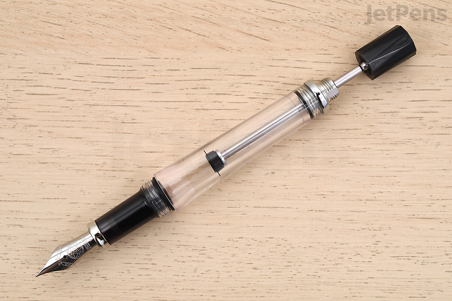 This type of fountain pen fills from an ink bottle with a built-in vacuum mechanism.