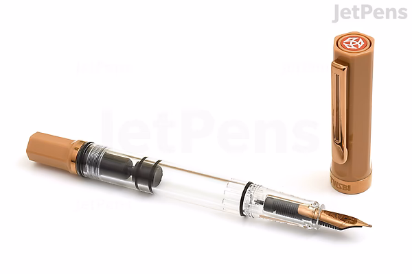 A TWSBI ECO Caffè Bronze Limited Edition fountain pen with an extra fine nib. The pen is shown uncapped, with the bronze-colored cap standing upright beside it. The pen body is transparent, revealing the internal ink reservoir and piston mechanism.