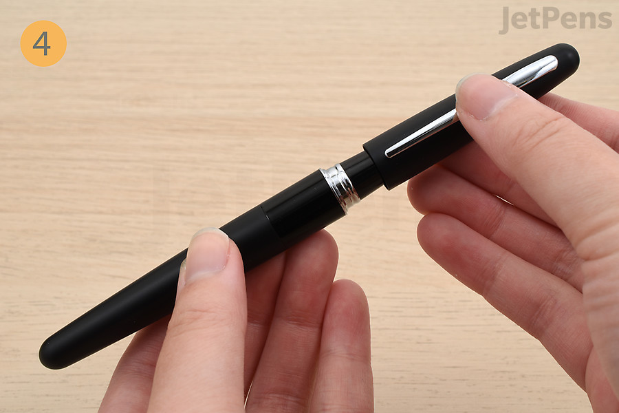 Reassemble the fountain pen and cap it.