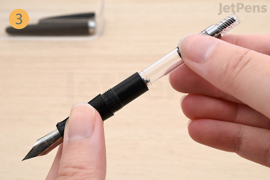 Insert the converter into the fountain pen’s grip section.