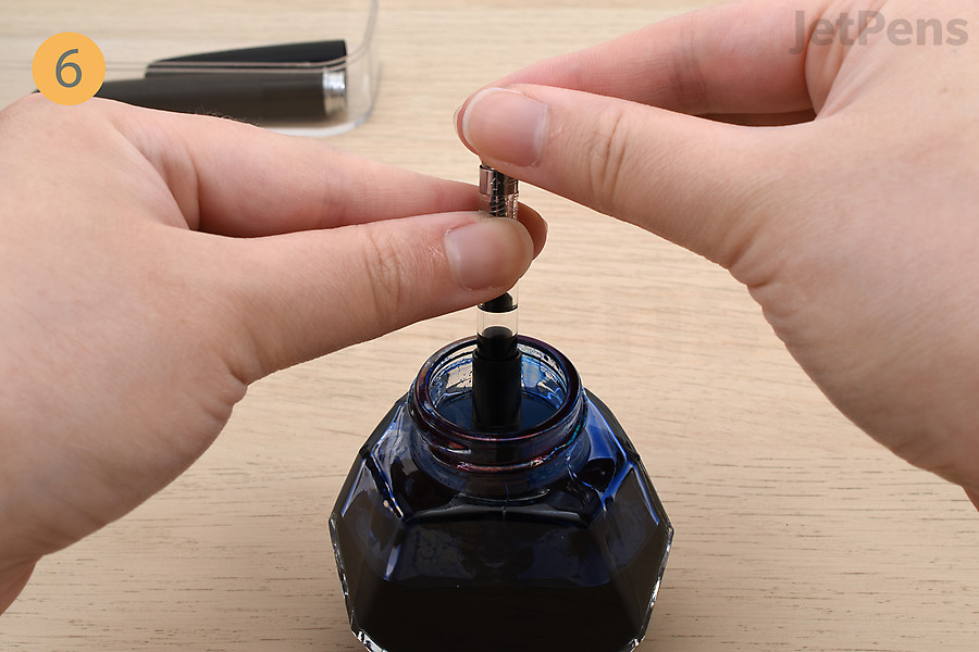 Twist the piston knob in the opposite direction to retract the piston and fill the converter’s reservoir.