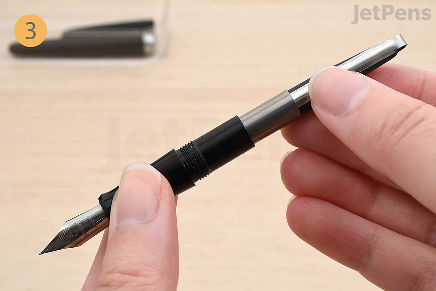 Insert the converter into the fountain pen’s grip section.