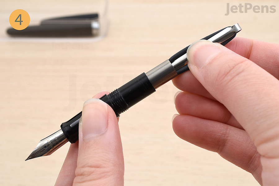 Squeeze and hold the converter.