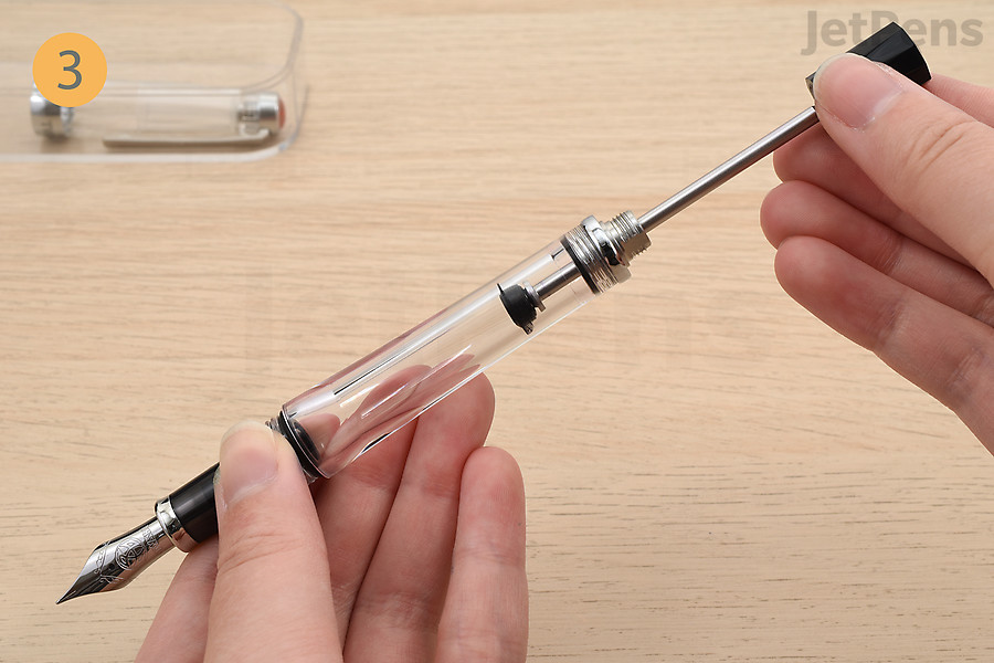 Pull back on the blind knob to retract the plunger.