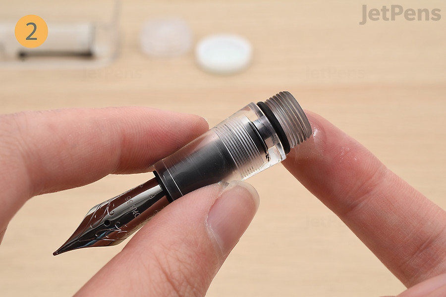 If needed, coat the threads of the grip section with silicone grease to ensure a watertight seal.