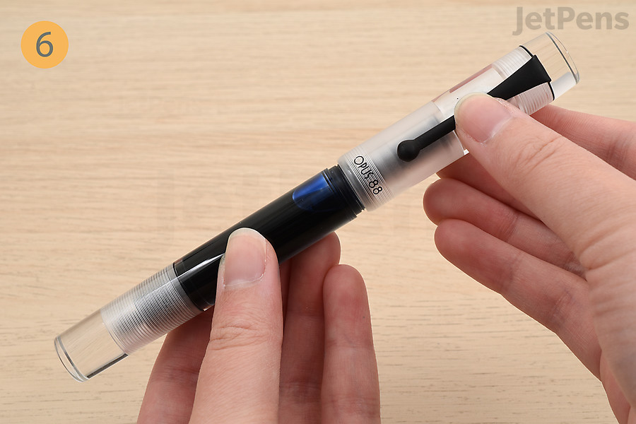 Reassemble the fountain pen and cap it.