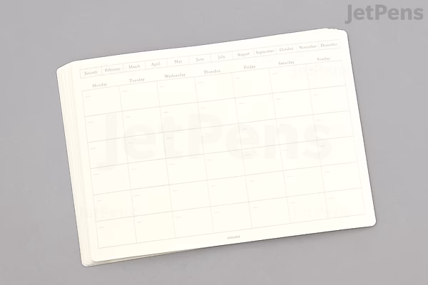 A sheet of STALOGY removable, undated monthly calendar stickers in medium landscape format, featuring blank grid boxes for dates and days of the week headers, designed for customizable use.