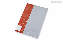 A KOKUYO PERPANEP A5 notebook with a light gray cover, featuring 3 mm graph grid pages, partially wrapped in red and white packaging.