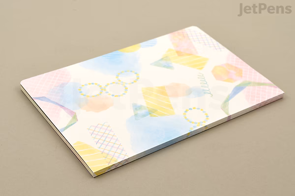 Midori Yuru Log Notebook B6 size with MD Cream paper, featuring 5 mm dotted grid and a soft watercolor design on the cover.