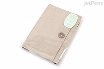 Beige cloth zipper pouch designed as a notebook cover, sized for B6 notebooks, with a button closure on the front flap.