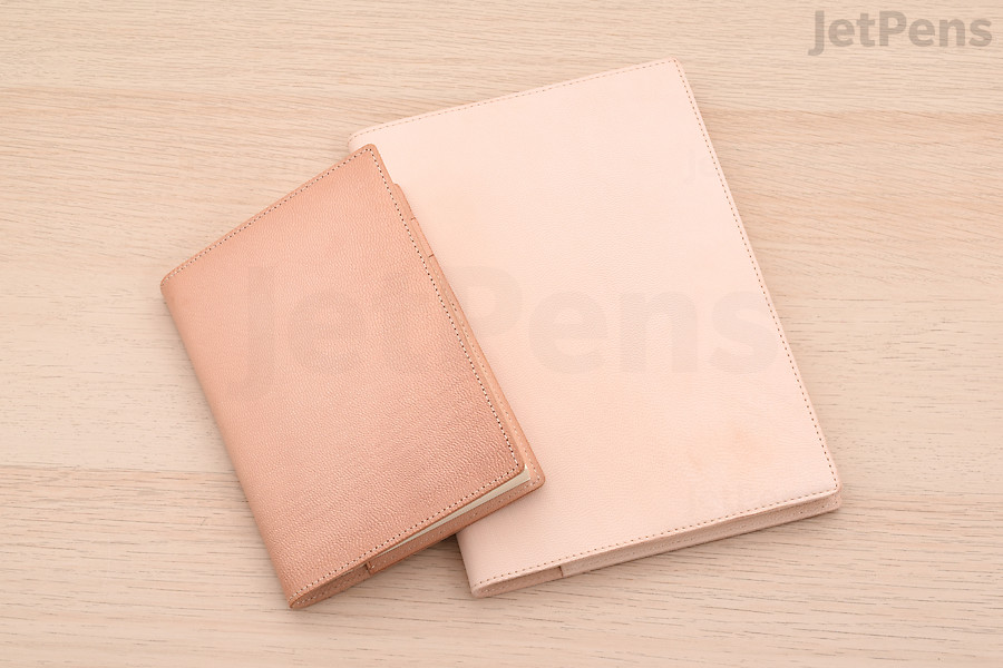 The luxurious Midori MD Leather Cover starts off a pale pink color (right) and slowly darkens over time (left).