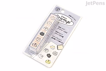 A Kamio Japan Favorites Stamp Set featuring six small cat face designs on a clear plastic strip, displayed in its original packaging with Japanese text.