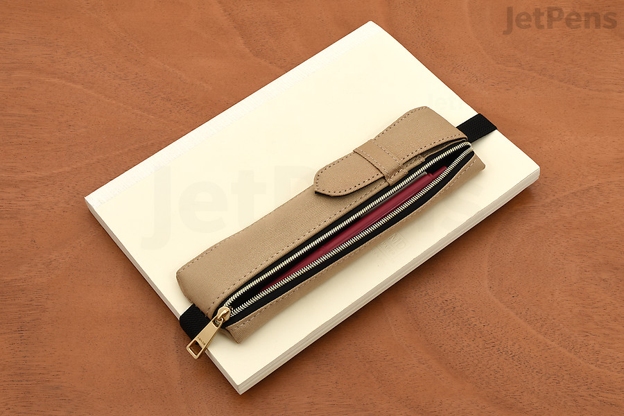 Midori Book Band Pen Cases come with adjustable straps so you can slip them over the covers of notebooks.