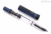 A TWSBI ECO Slate Blue fountain pen with a transparent barrel and black fine nib, shown uncapped with the cap placed beside it.